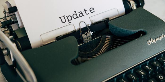 Old typewriter has typed the word 'Update' on paper